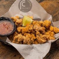 Popcorn Chicken · Bite-sized chicken pieces marinated and fried
to perfection.