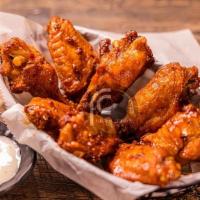Chicken Wings (7) · Crispy fried chicken wings coated with choice of flavors: Cajun, Buffalo, Lemon Pepper, or M...