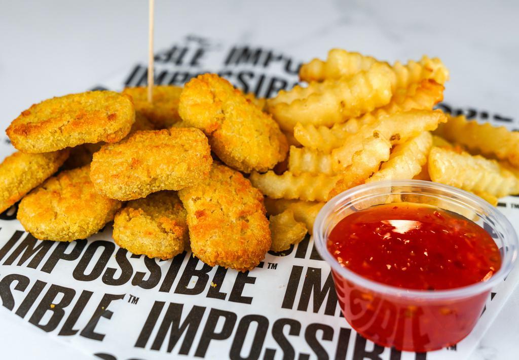 10 Impossible Nugget Combo · 10 Crispy Impossible chicken nuggets fried to perfection and served with fries along with your choice of dipping sauce