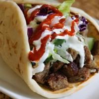 Beef Wrap · Beef and lamb perfectly seasoned with authentic Mediterranean spices wrapped in a warm pita ...