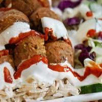 Falafel Platter · Falafel can be over Rice, Salad or French Fries. All plates come with a side of salad and to...