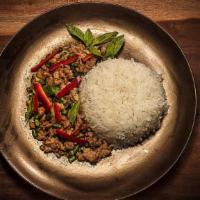 Pad Kra Praow · Basil and chili. Sautéed with ground meat and fresh chili, garlic, red pepper, and holy basil.