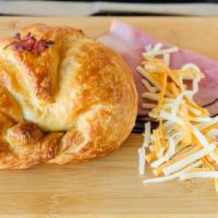 Ham And Cheese Croissant · Includes: Ham and Cheddar Cheese on croissant.