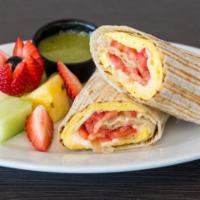 Breakfast Burrito · Egg, cheese, tomato & caramelized onions, Served with salsa verde & fresh fruit.