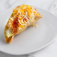Crispy Beef Taco · Shredded Beef w/ lettuce, monterey jack and cheddar cheese, tomato, and red salsa in a crisp...