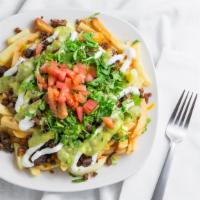 Carne Asada Fries · Choice of meat, fries, guacamole salsa, sour cream and Melted cheese, cilantro, and tomatoes
