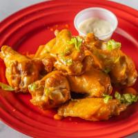Lemon Pepper · 8 traditional wings* tossed in lemon pepper (mild heat), served with carrots & celery and a ...