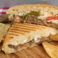 La Cheese Steak Panini · Minute steak with caramelized onions and sauteed peppers, grated 4 cheese, and Dijonnaise on...