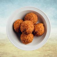 Funky Falafel  · Mashed chickpea and fava bean mix, seasoned with fresh herbs & pan fried crisp