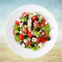Greek Salad Getaway · Fresh greens Greek salad tossed with Kalamata olives