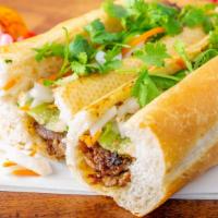 Pork Bánh Mì · BBQ Pork in a fresh Baguette with pickled carrot and daikon, cilantro, jalapeño and seasoned...