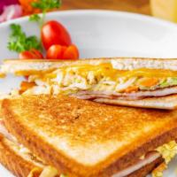 Street Toast · Toasted white bread with egg, ham, carrot, cabbage, green onion and cheese with a sweet and ...