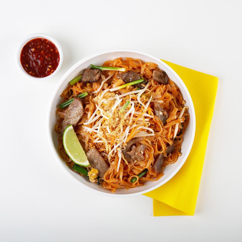 Beef Pad Thai · Stir-fried rice noodles with beef, scallions, bean sprouts, scrambled egg, and crushed peanuts.
