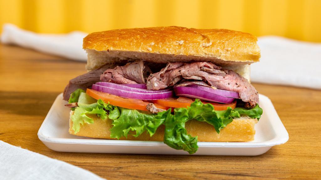 Tri-Tip Sandwich · Thin sliced tri-tip, lettuce, tomato, onion, special sauce, served on a baguette roll. Add cheese ,meat for an additional charge.