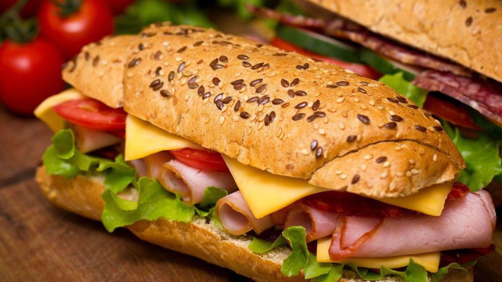 Turkey Sandwich Combo · Thin sliced smoked turkey, lettuce, tomato, cheese, onion and special sauce, served on a baguette roll.