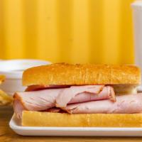 Turkey Dip Sandwich Combo · Thin sliced smoked turkey, served on a baguette roll, with a side of au jus sauce.