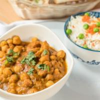 Chana Masala · Chickpeas cooked with onion and tomato fired masala.