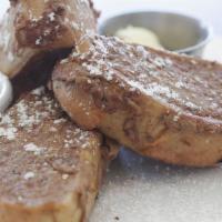 French Bread Toast · French bread dipped in eggs, milk and cinnamon and grilled golden brown. Served with whip bu...