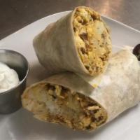 Breakfast Burrito · Scramble eggs, chorizo, and hash brown smothered with salsa wrapped in flour tortilla.