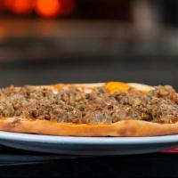 Salsiccia - Chef'S Choice · Homemade Italian sausage and tomato sauce baked in a wood-fired oven.