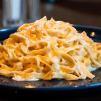 Fettuccine Alfredo · Fresh homemade fettuccine in a buttery alfredo cream sauce.