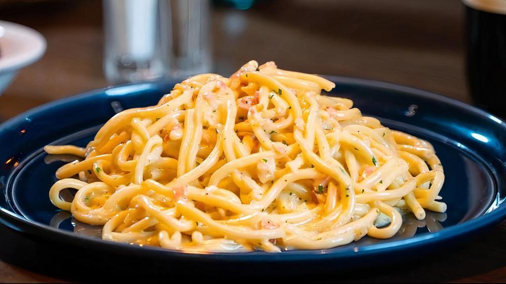 Carbonara Pasta · Spaghetti with pancetta, Reggiano, egg yolk and parsley.
