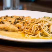 Chicken Piccata · Sauteed chicken breast in a lemon white wine butter sauce with shallots and capers