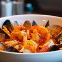 Seafood Cioppino · Shrimp, clams, mussels, scallops, and calamari in a spicy garlic tomato broth.