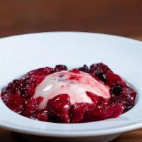 Panna Cotta · Traditional Italian chilled creamy vanilla bean flan with seasonal berry coulis.