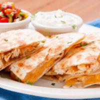 Crispy Chicken Quesadilla · A large handmade flour tortilla stuffed with crispy chicken, a blend of melted cheese, and p...
