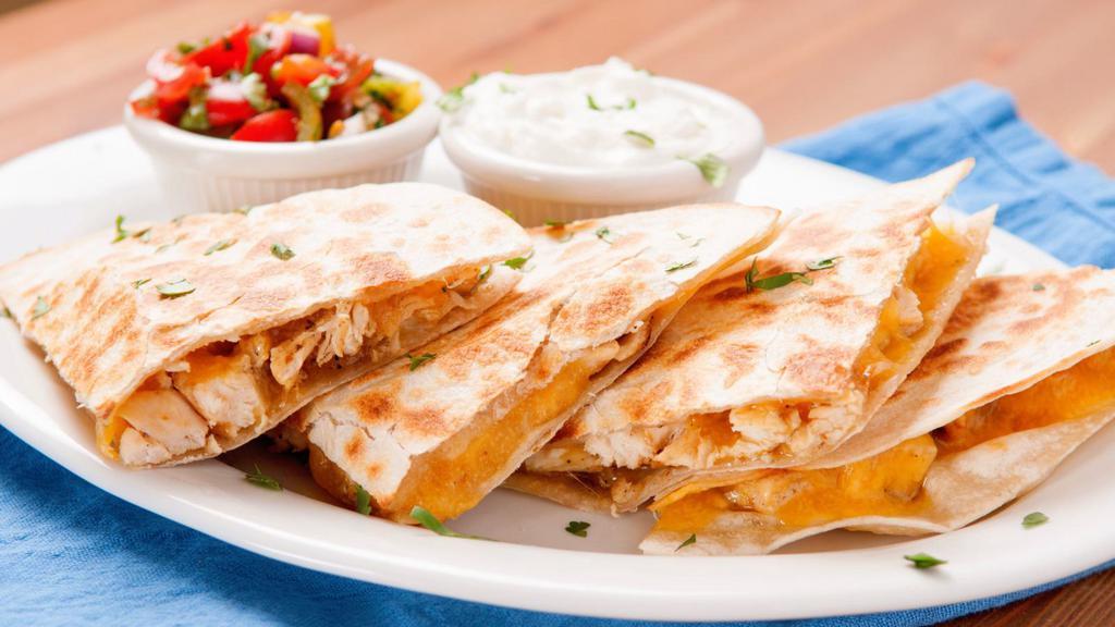Crispy Chicken Quesadilla · A large handmade flour tortilla stuffed with crispy chicken, a blend of melted cheese, and pico de gallo. Served with a choice of sour cream or salsa.