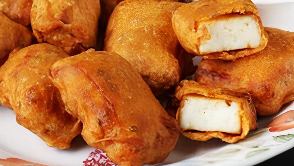 Paneer Pakoda (6 Pcs.) · Cottage cheese deep fried in a thick gram flour and spices.