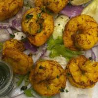 Tandoori Shrimp · Shrimp Marinated in spices cooked in special clay oven.