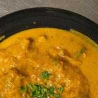 Goat Korma  · Goat cooked in mild spices with onions and cream.