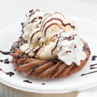 Churro Sundae · A hand-twisted churro delight with your choice of ice cream, fruit and/or sauce plus homemad...