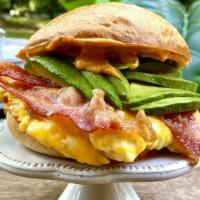 Ultimate Breakfast Sandwich · Scrambled eggs with a cheddar & jack cheese blend, served with bacon, avocado, and chipotle ...