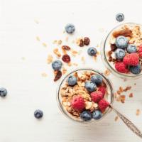 Yogurt Parfait · Homemade vanilla yogurt with a variety of fruits and berries as well as almond granola.