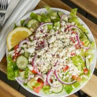 Greek Salad · Crisp lettuce, tomatoes, cucumbers, onions, and olives, combined with a swirl of extra virgi...