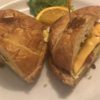 Egg Croissandwich · Two scrambled eggs with melted cheese and your choice of meat on a toasted fresh Croissant.