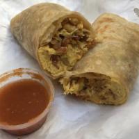 Breakfast Burrito · Scrambled eggs with potatoes, cheese and your choice of meat