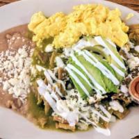 Chilaquiles Plate · Crispy tortillas chips tossed with our special sauce, chopped onions and cilantro and topped...