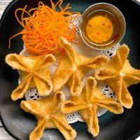 Cream Cheese And Crab Wontons · Deep-fried wonton skins with a cream cheese and crab filling.
