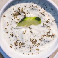 Yogurt Dip · Cucumber and mint dip made with strained yogurt. Served with pita bread.