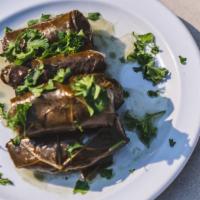 Dolme · Tender grape vine leaves stuffed with a blend of lemon, rice and herbs. Each order includes ...