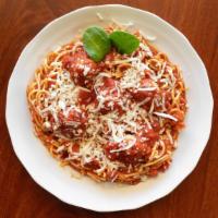 Spaghetti And Meatballs · Homemade meat sauce with two meatballs and topped with Parmesan cheese.