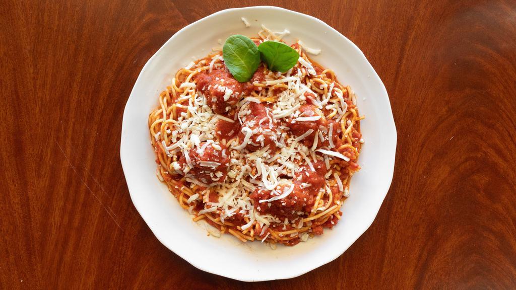 Spaghetti And Meatballs · Homemade meat sauce with two meatballs and topped with Parmesan cheese.