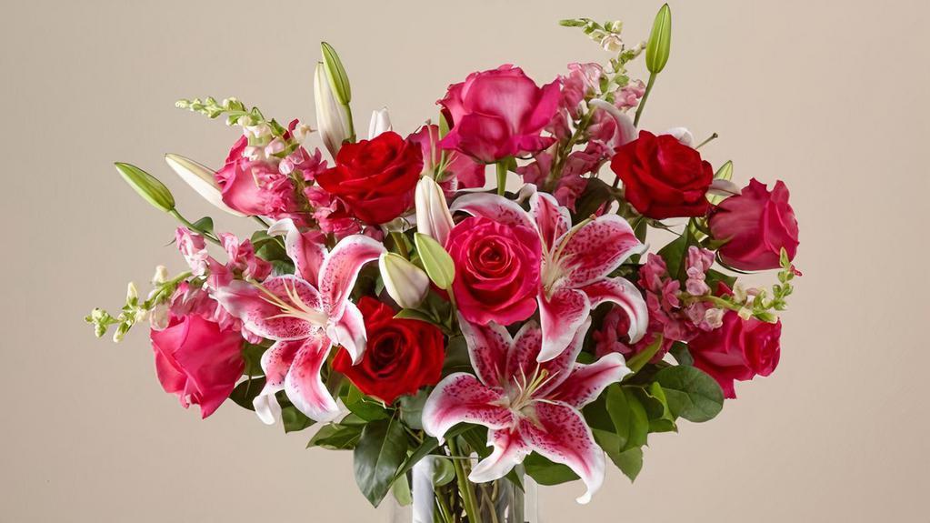 Always You Luxury Bouquet · Tell your one true love that you were always meant for each other with this bouquet of blooming flowers. Red & hot pink roses, lilies & snapdragons combine into the stunning bouquet your one true love deserves.