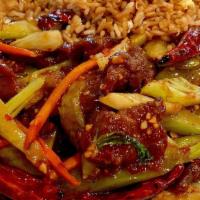 Szechuan Beef · Marinated beef served in a sauce of seared red pepper and onion with bamboo shoot, canal, an...