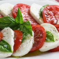 Caprese Salad · Buffalo mozzarella, marinated tomatoes, basil & olive oil.
