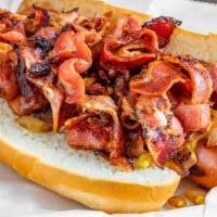 Pastrami Dog · House smoked beef pastrami over a kosher dog with mustard and grilled onion.
